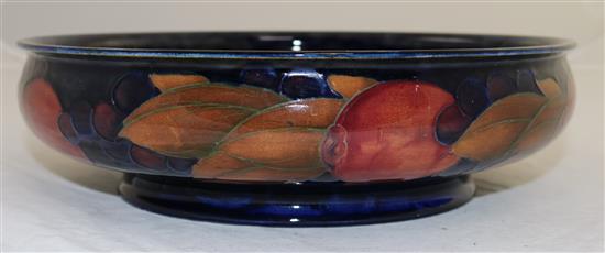 A William Moorcroft pomegranate blue ground footed shallow bowl, diameter 29cm